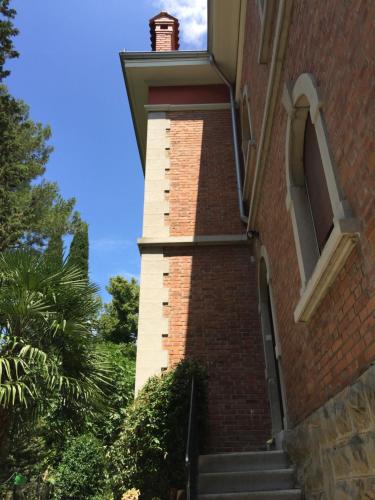 a brick stairway leading up to a building at Rooms Portorose Center in Portorož