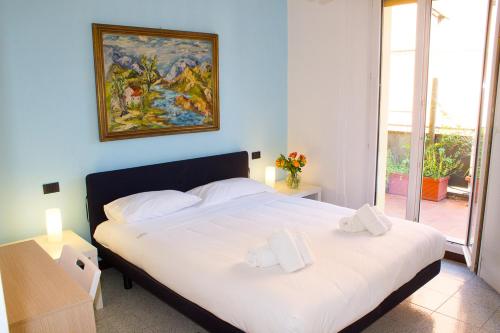 Postel nebo postele na pokoji v ubytování GetTheKey Vicolo Bianco Apartment