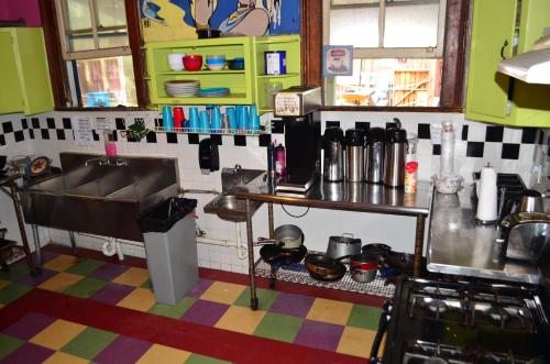 a small kitchen with a sink and a counter at India House Hostel in New Orleans