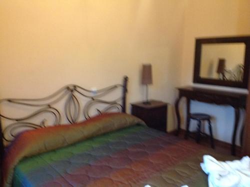 Una cama o camas en una habitación de Molivos Sunset Apartments