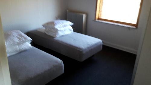 Giường trong phòng chung tại Jerupvej Holiday Home