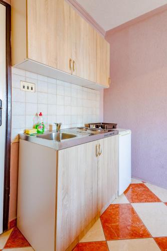 Kuchyň nebo kuchyňský kout v ubytování Apartments Tati