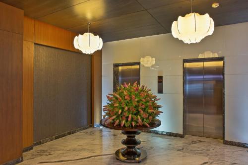 a light fixture in the corner of a room at Clarion Hotel President in Chennai