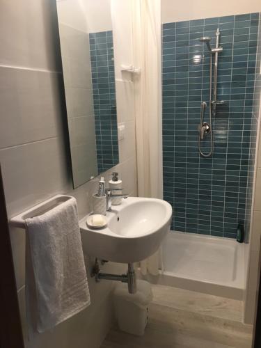 a bathroom with a sink and a shower at Appartamenti Cala Azzurra in Scopello