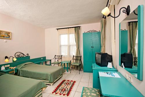 Postel nebo postele na pokoji v ubytování Titan Club Hotel Ultra All Inclusive