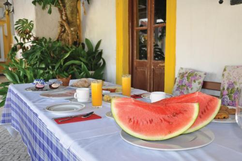 a table with two slices of watermelon on it at Sleep In Bucelas in Bucelas