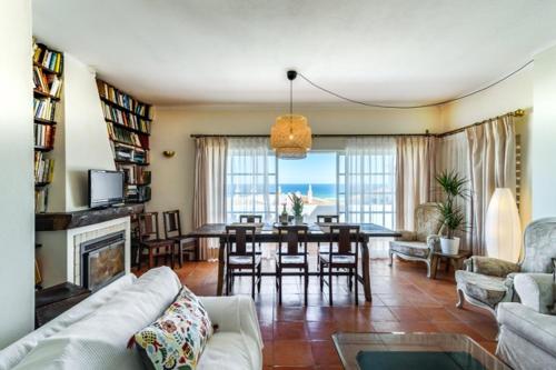 a living room with a couch and a dining room at York House in Lagos
