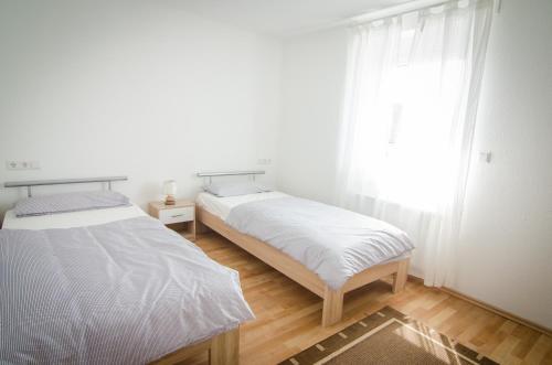 Llit o llits en una habitació de BB-Apartment