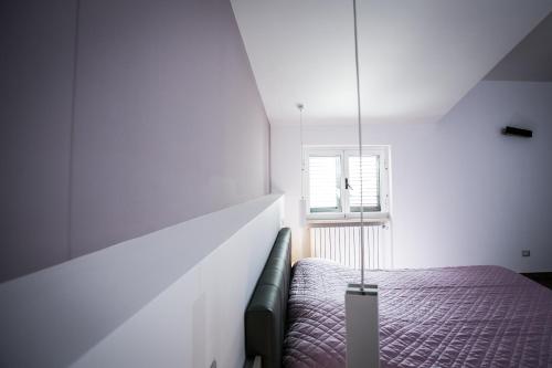 a bedroom with a bed and a window at I Love Puglia in Conversano