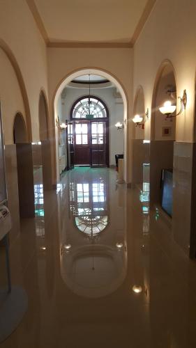 an empty hallway with a glass floor and a window at Hotel Bristol in Tarnów