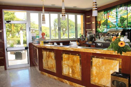 a kitchen with a large counter with a bar at Complesso Termale Vescine in Castelforte