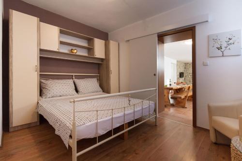 Posteľ alebo postele v izbe v ubytovaní Apartmani Maksan