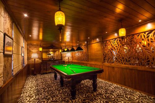 a billiard room with a green pool table in it at La Grande Villa in Nuwara Eliya
