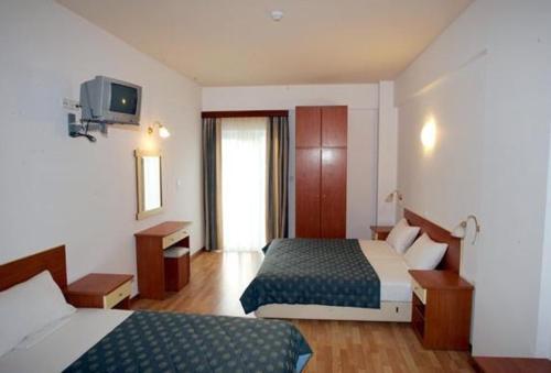 Postel nebo postele na pokoji v ubytování Hotel Filoxenia Beach