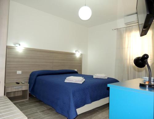 Un pat sau paturi într-o cameră la La Stradetta