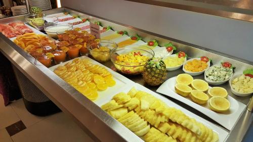 a buffet with many different types of food on a table at Mamba Point Hotel in Monrovia