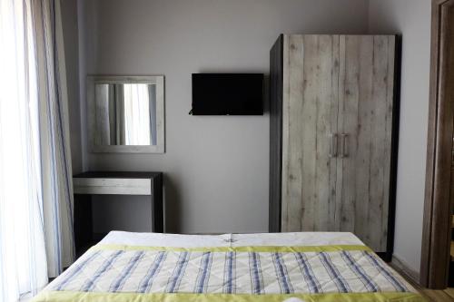 Ένα ή περισσότερα κρεβάτια σε δωμάτιο στο Paramithi Luxury Apartments