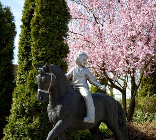 a statue of a man riding a horse at Hotel Restaurant Eeserhof in Ees