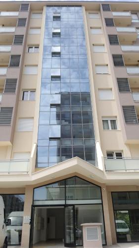 a tall building with a lot of windows at Zebra in Podgorica