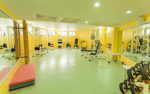 a gym with a lot of equipment in a room at El Mouradi Hammam Bourguiba in Ain Draham