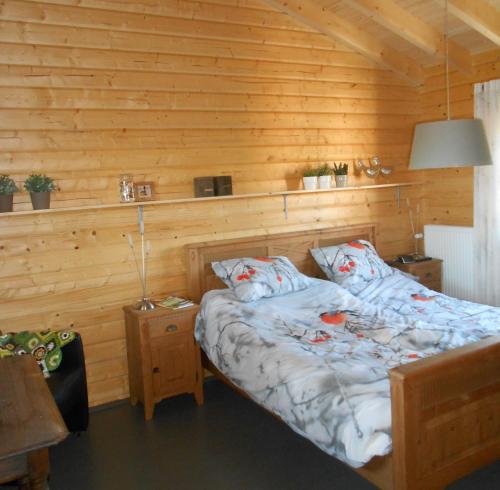 Ένα ή περισσότερα κρεβάτια σε δωμάτιο στο De Priesnitzhoeve