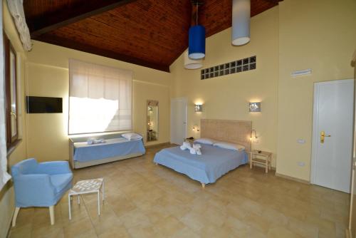 Hotel Costa Paradiso tesisinde bir odada yatak veya yataklar