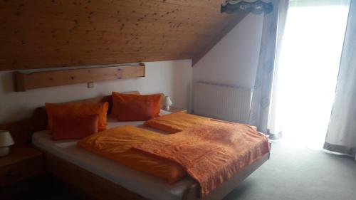 Cama o camas de una habitación en Alpengasthof Hoiswirt