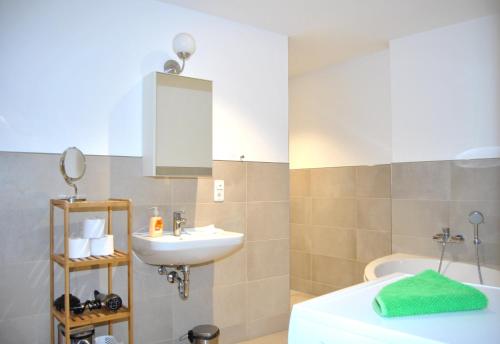 Ένα μπάνιο στο Vailo City Suites Leipzig Altstadt
