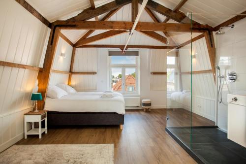 Postel nebo postele na pokoji v ubytování Stayci Serviced Apartments Royal Palace