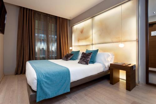 Letto o letti in una camera di Hotel España Ramblas