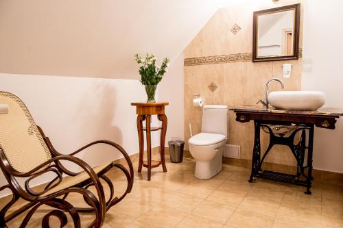 a bathroom with a toilet and a sink at Pałac na Wodzie Hotel & SPA in Jelenia Góra