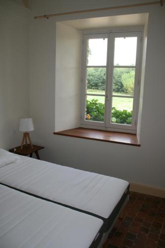 Posteľ alebo postele v izbe v ubytovaní Le Gite du Grand Saulaie