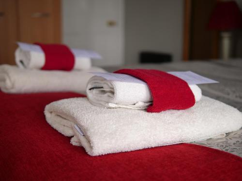 a group of towels sitting on top of a bed at Belvedere in Brodick