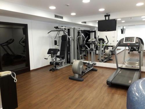 a gym with treadmills and elliptical machines at Mercure Monte Igueldo in Donostia-San Sebastián