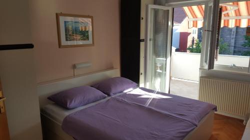 Postel nebo postele na pokoji v ubytování Apartman Marija