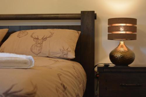 Katil atau katil-katil dalam bilik di Whitehouse B&B