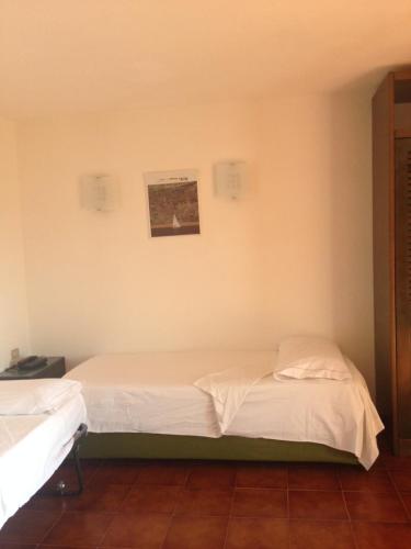 Posteľ alebo postele v izbe v ubytovaní Residenza Chrysalis Bay
