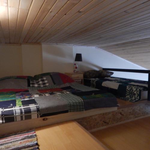 a bedroom with two beds in a attic at Room 46 in Gudauri