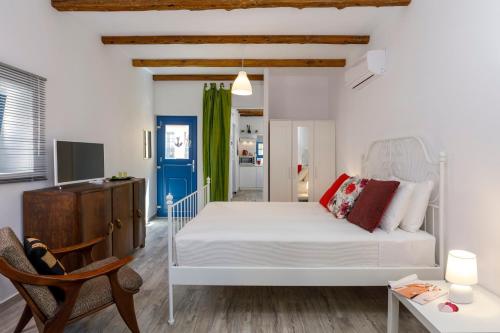 Ένα ή περισσότερα κρεβάτια σε δωμάτιο στο Casita Del Sol Suites