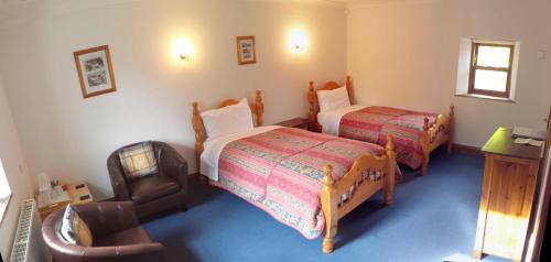 En eller flere senge i et værelse på Belle Vue Country