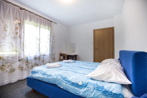 ASGARD Guesthouseにあるベッド