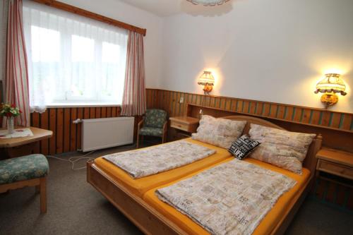 Postel nebo postele na pokoji v ubytování Chata Javorina