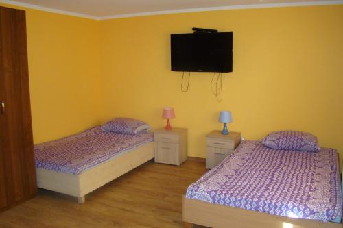 En eller flere senge i et værelse på Ostoja Becejły