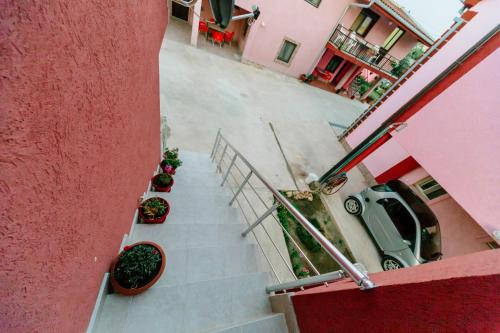 an overhead view of stairs with potted plants at MC Apartments in Ulcinj