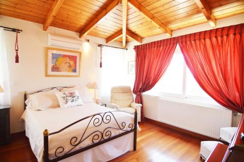 Voodi või voodid majutusasutuse Villa Lagonisi 1 toas