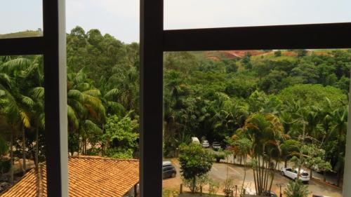 a view from a window of a parking lot at Hotel Chapadao Da Canastra in São Roque de Minas
