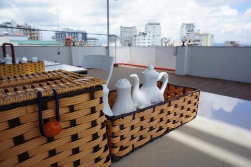 two baskets sitting on top of a roof at Poetic Hue Hotel & Spa in Hue