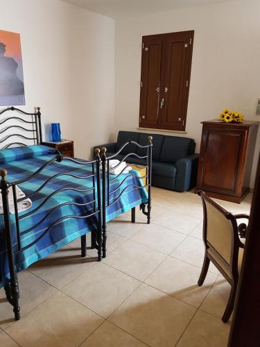 Ένα ή περισσότερα κρεβάτια σε δωμάτιο στο B&b Cocuma