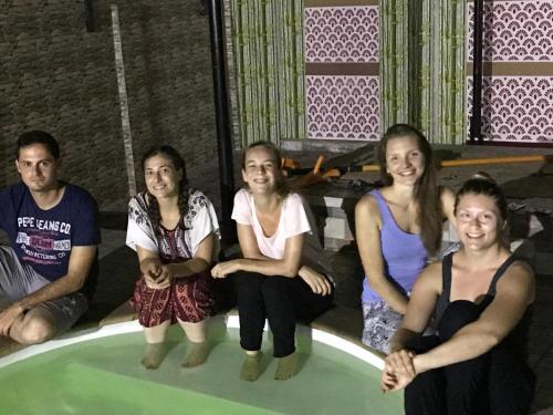 a group of people sitting in a bath tub at Palm Rivera Kochi in Cochin