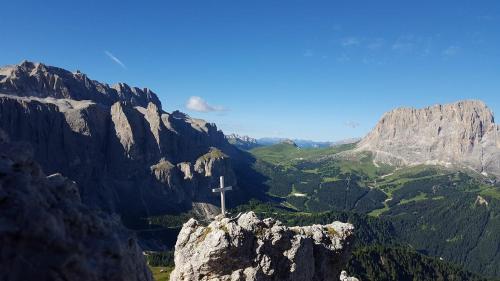 a cross on the top of a mountain at Garni Franca b&b in Selva di Val Gardena